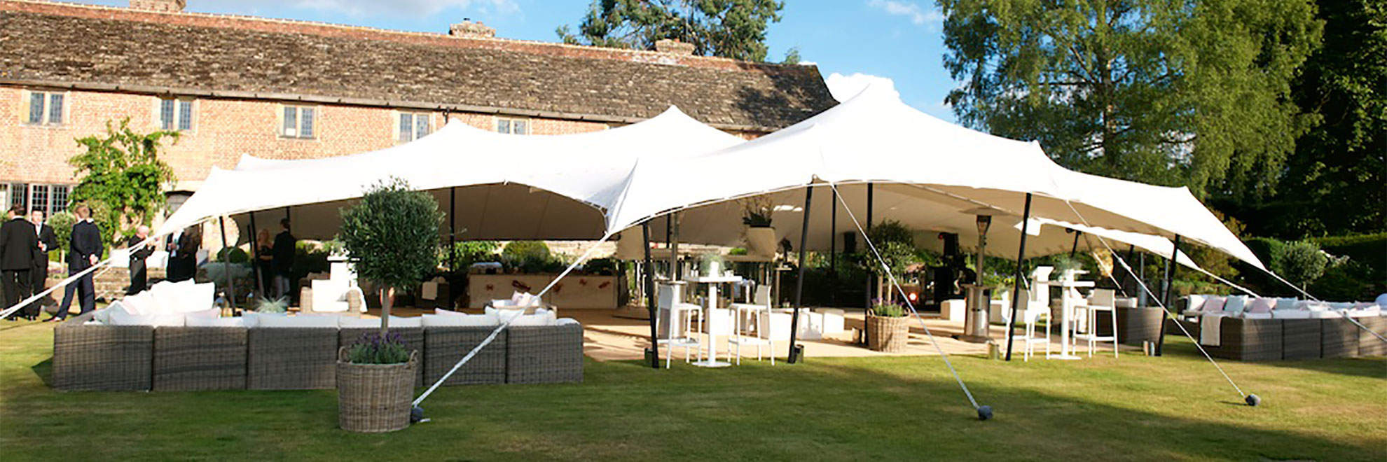 White stretch tent with separate lounging area and bar area