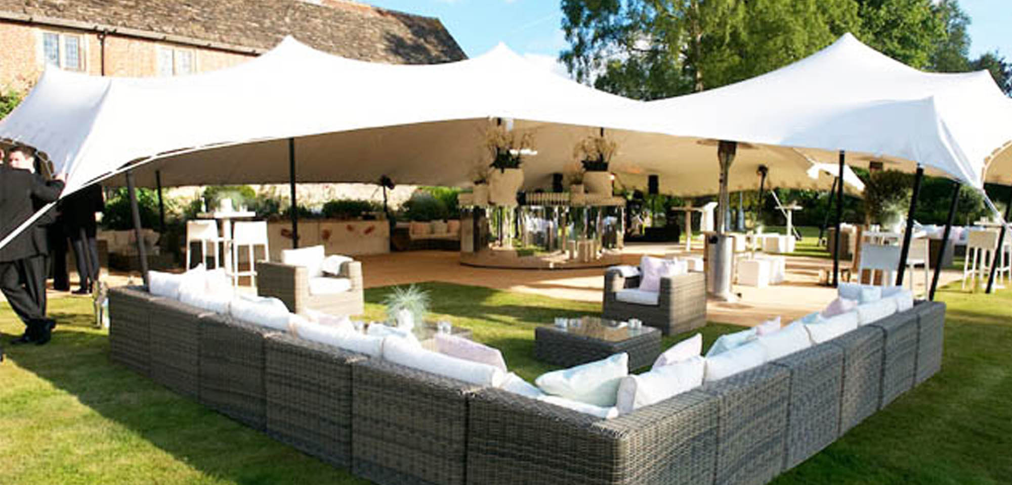 Large White Stretch Tent in Garden with outdoor furniture